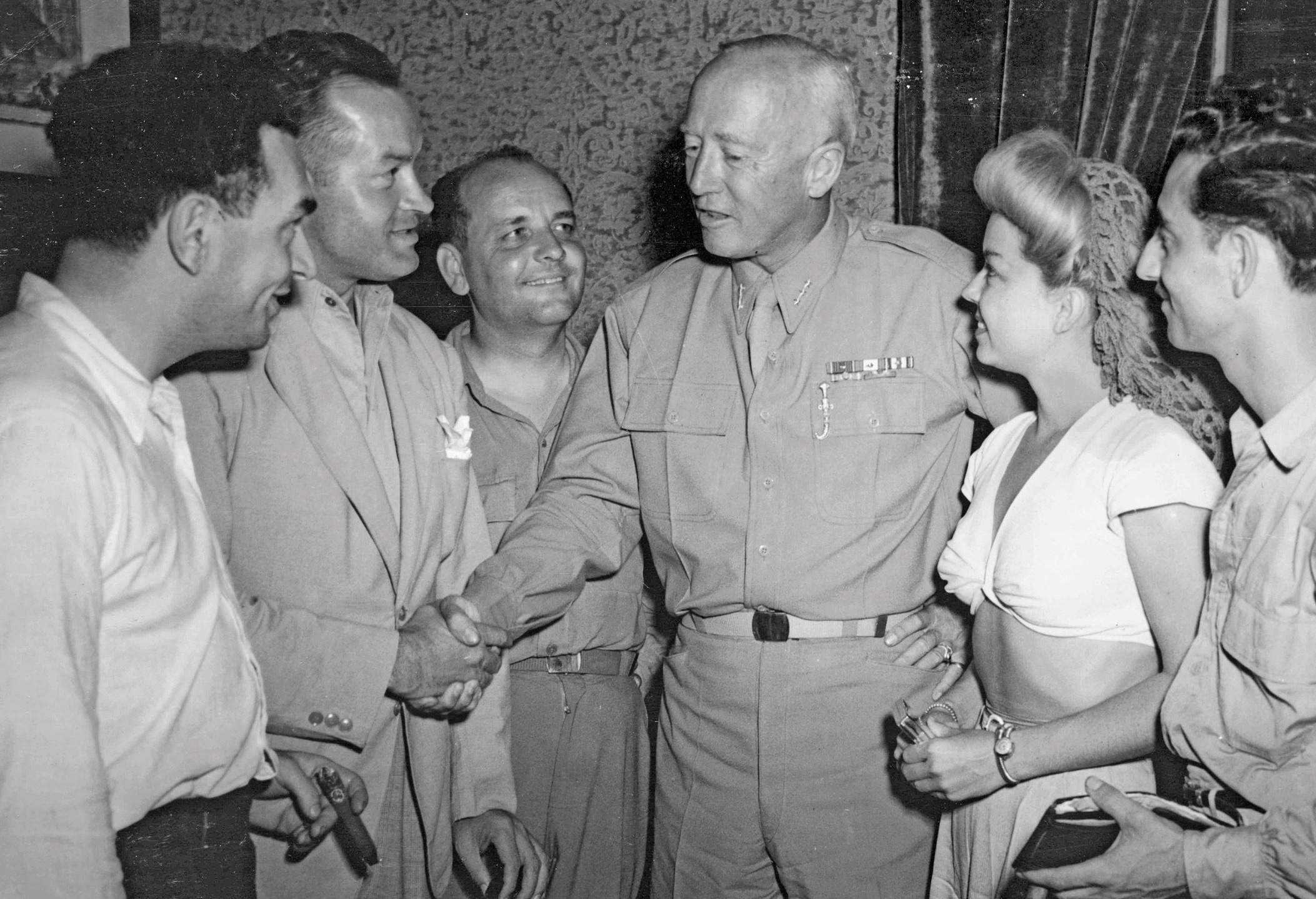 Bob Hope and actors meeting General George Patton in Sicily during World War II. 